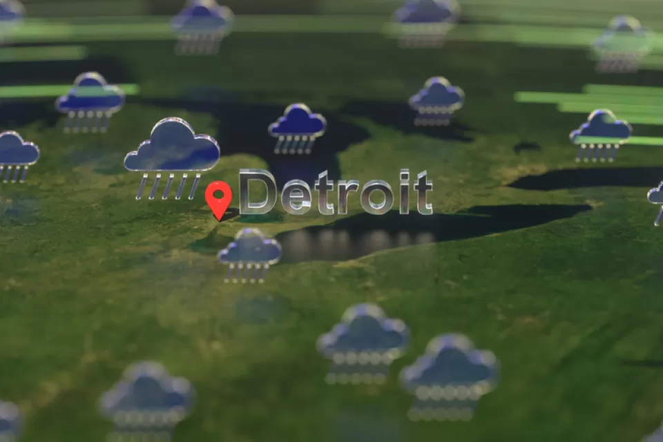 An illustration of rain clouds gathered over the U.S. Midwest, with the city of Detroit called out on the map.